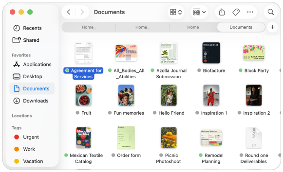 Mac Finder med mappen Documents åpnet. Downloads er synlig rett nedenfor